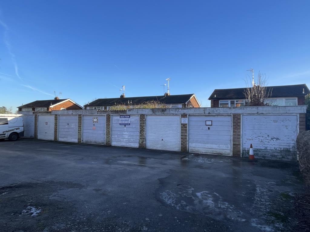 Lot: 10 - LAND AND SIXTEEN GARAGES WITH POTENTIAL FOR DEVELOPMENT - View of western block of eight garages